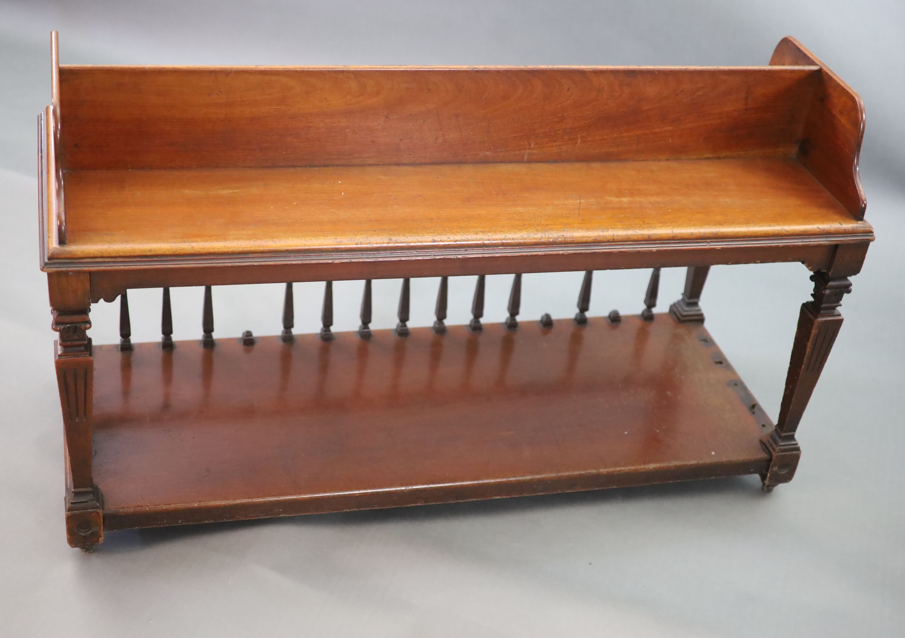 A Victorian mahogany freestanding bookcase, supplied by Sage & Company Shopfitters of London, W.131cm D.51cm H.76cm